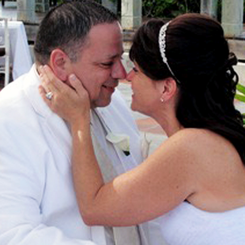 Happy Couple Embracing at Wedding