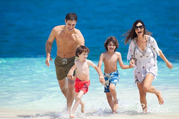 Family on the beach at Beaches Resorts